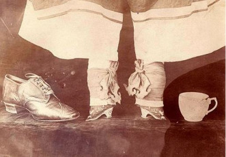 Footbinding | bound shoes beside a full size shoe
