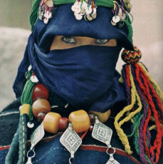 A Moroccan woman wearing pendants bearing the Tihuna symbol - Photo by Angela Fisher